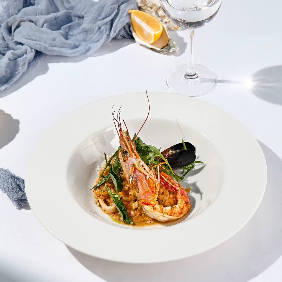 Teller mit Risotto Frutti di Mare